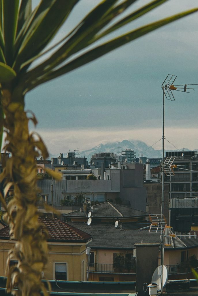 rooftops-and-distant-mountains-under-a-cloudy-sky-dethm1f1z5w Mountain
